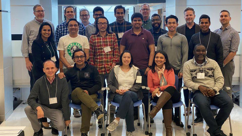 Evernorth Research Institute team posing for a photo in a modern office setting
