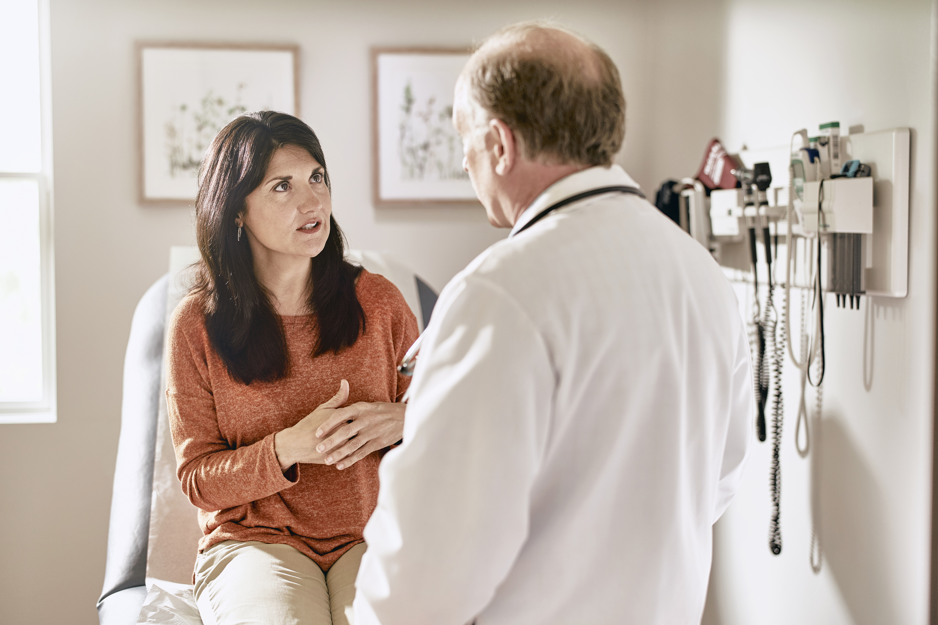 Woman speak with physician