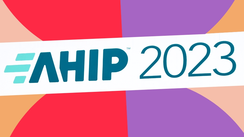 AHIP 2023 logo on vibrant abstract background of red purple and orange geometric shapes
