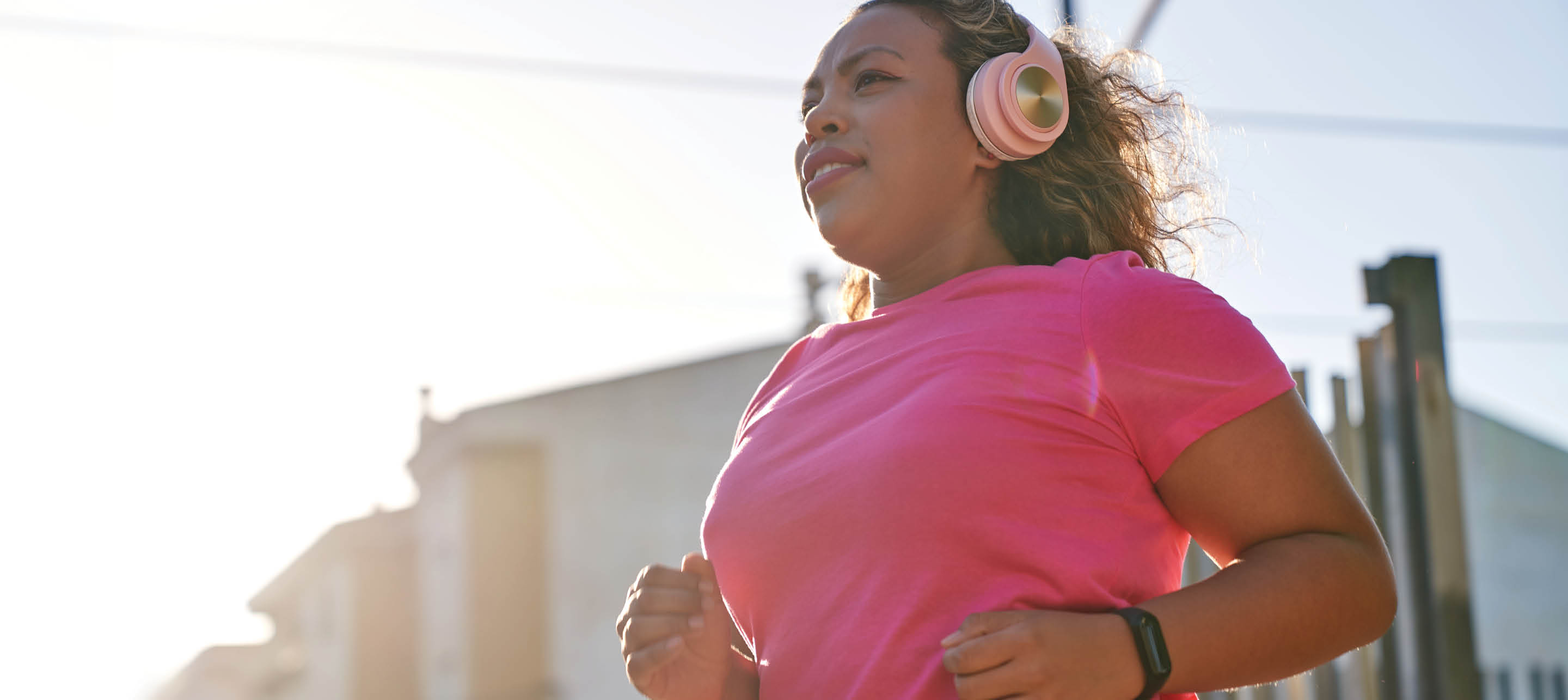 Woman jogging outside with headphones