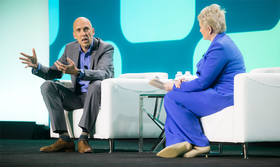 Eric Palmer in a seated interview on a stage.