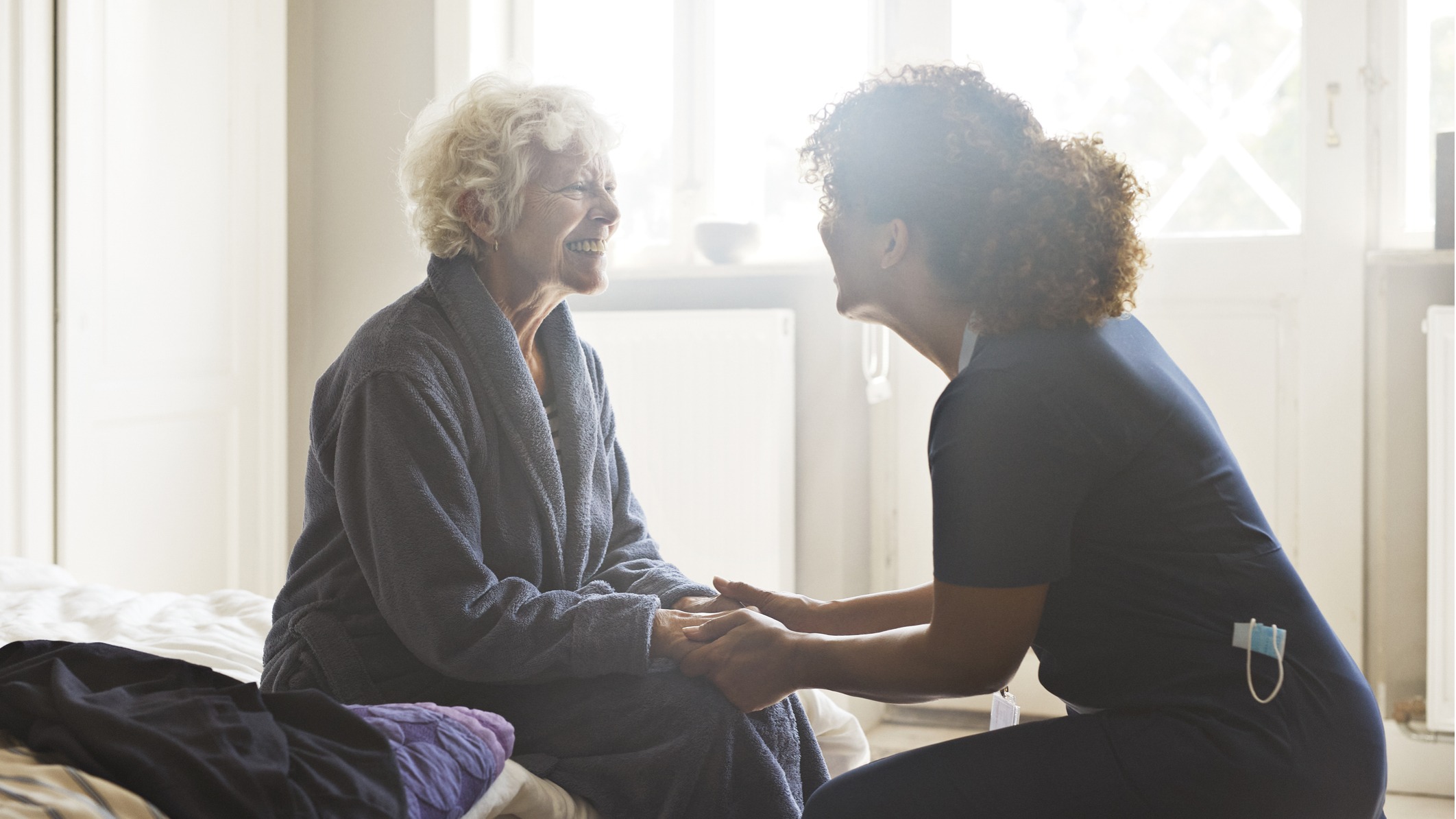 Elderly woman receiving care in her home.