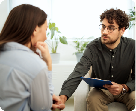 Man holding blue folder holding hand of woman