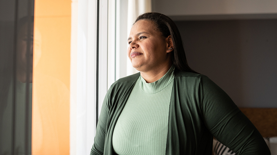 woman looking out window