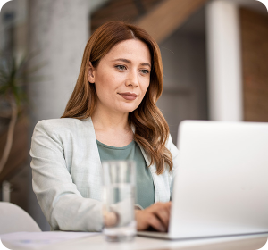 woman sits at laptop