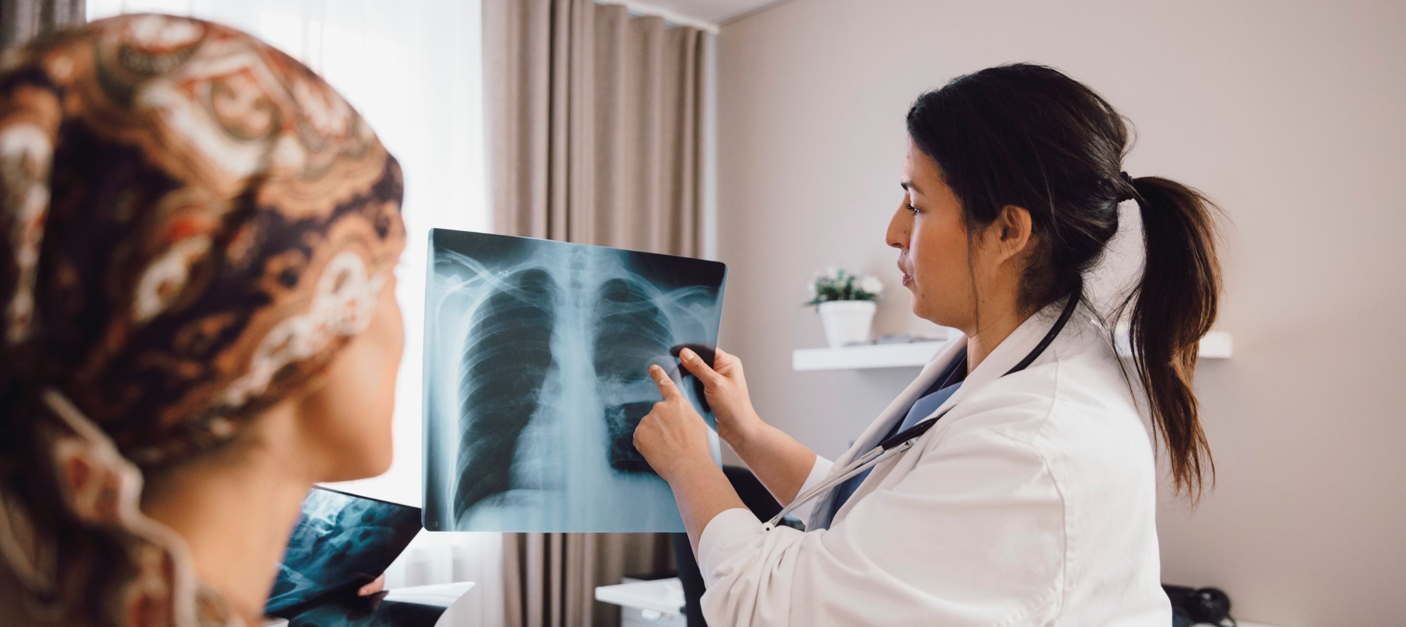 Doctor analyzing an x-ray.