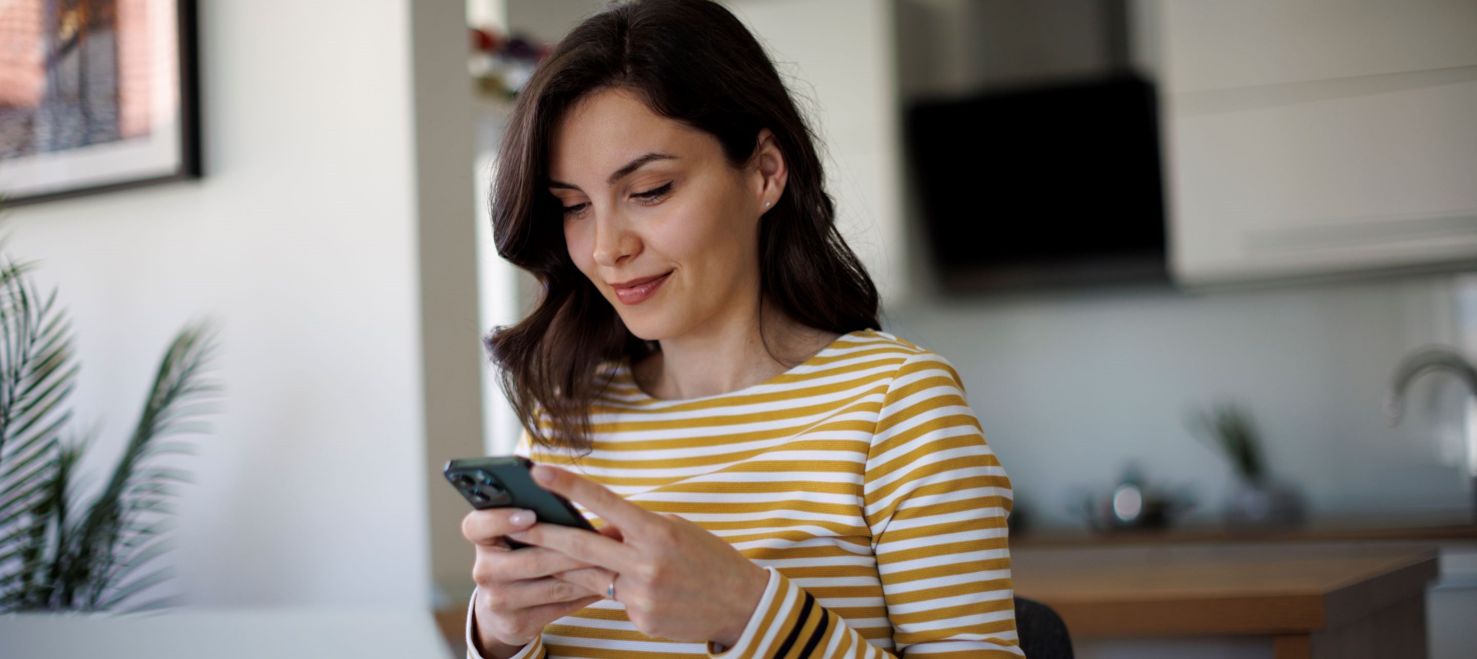 Woman looking at phone.