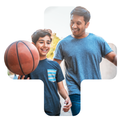 man and kid with basketball