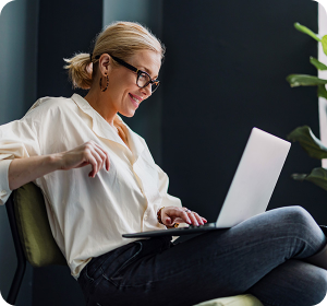 woman smiling at laptop