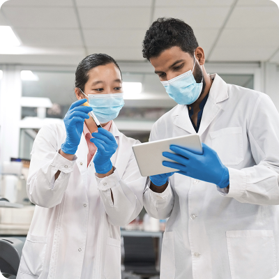 two people with masks and gloves