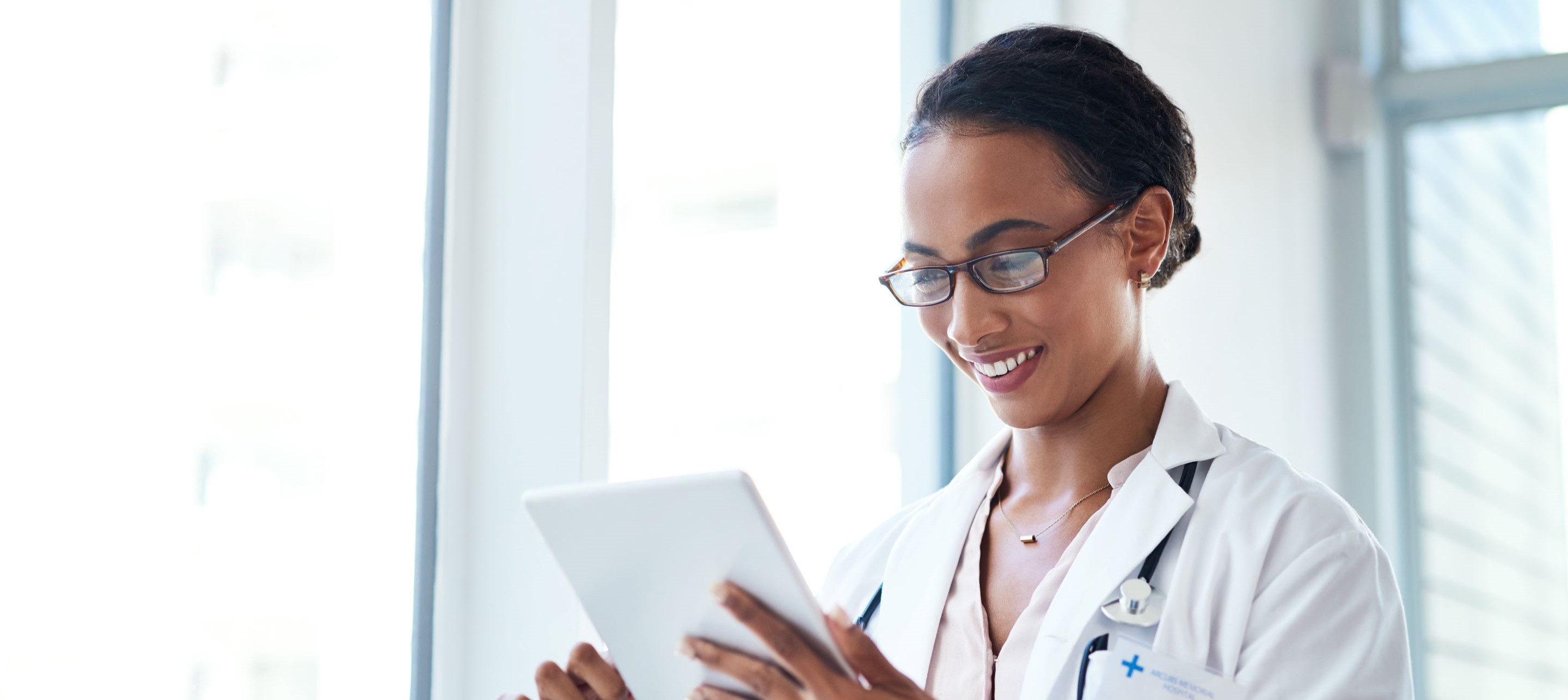 Woman holding a tablet.