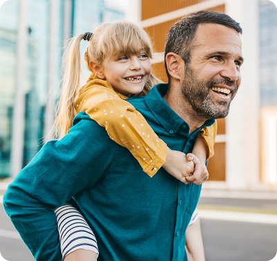man with girl on his back