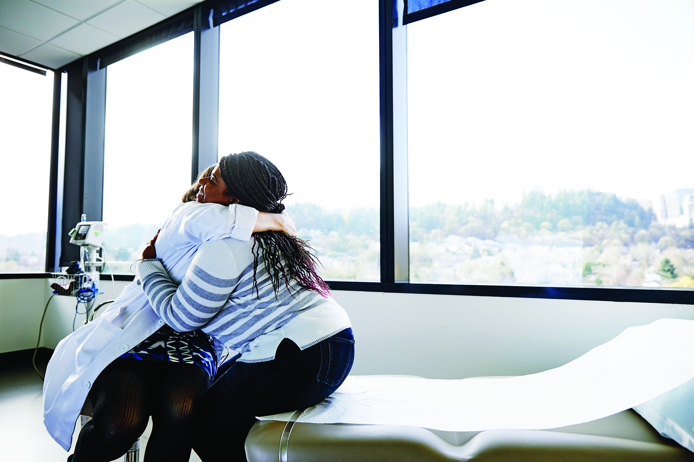 a person hugging another person