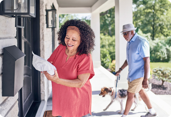 woman receiving pharmacy package