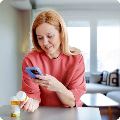 patient with pill and phone