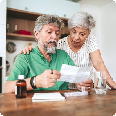 elderly people reading paper