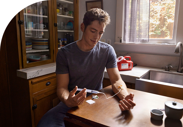 boy injecting himself with medicine