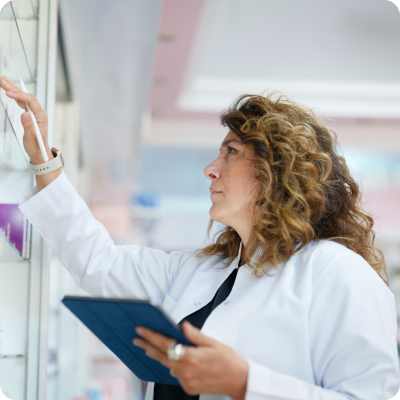 pharmacist looking at shelf 