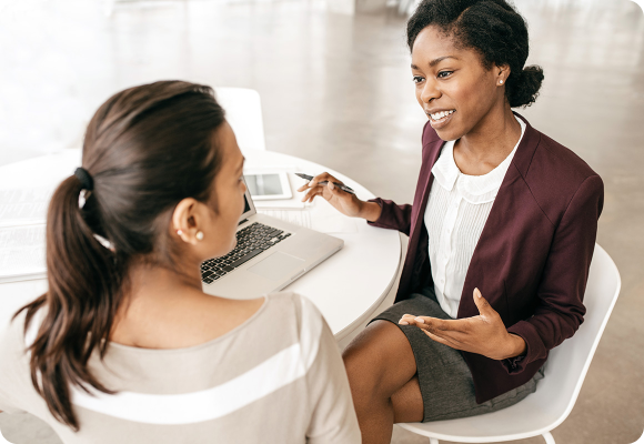two women with laptop