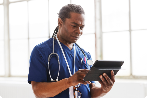 Medical professional look at tablet