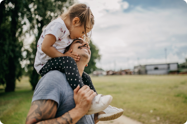 Kid on father's shoulders