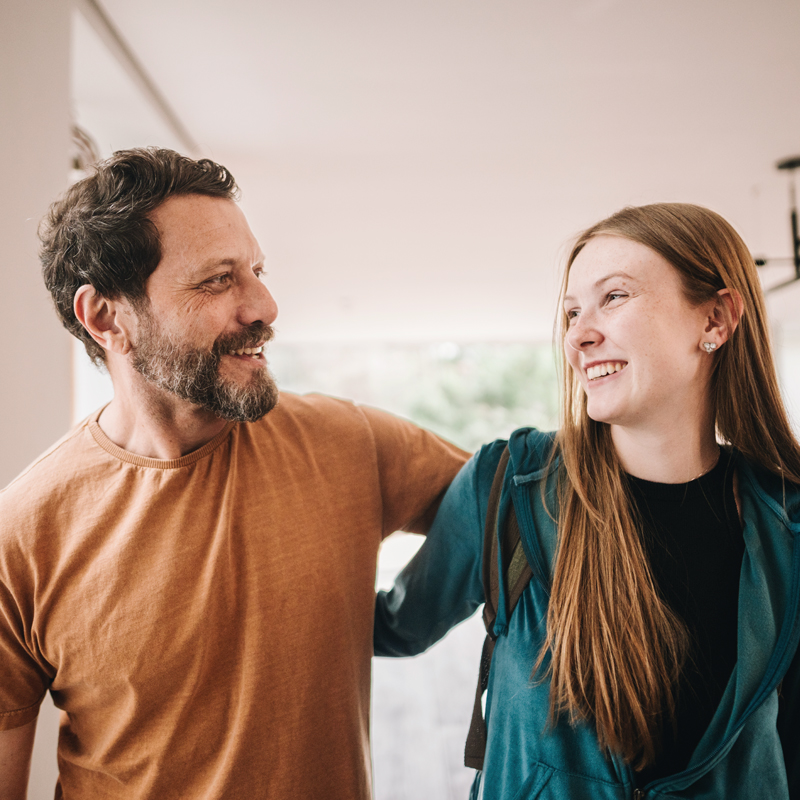 man and woman with arm around each other