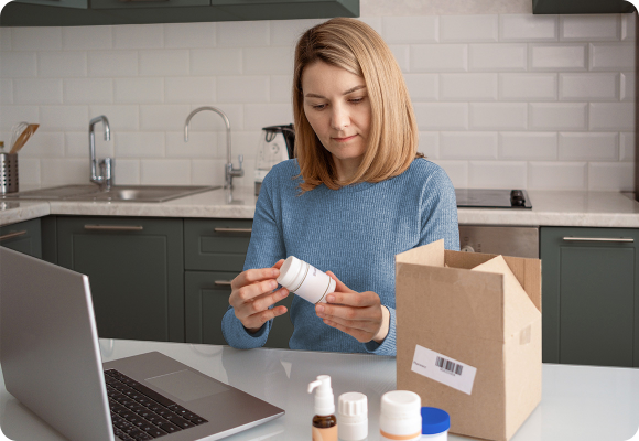 woman with pharmacy box