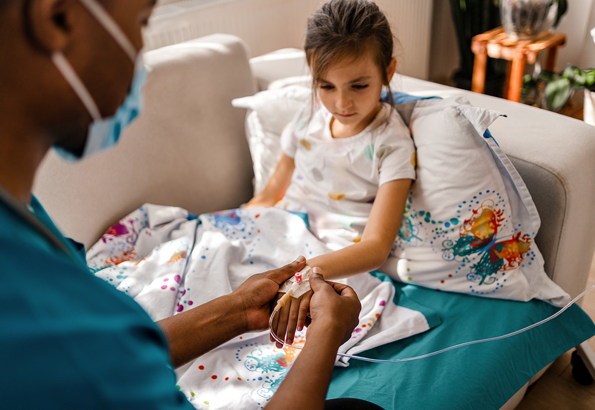 young girl getting infusion treatment 