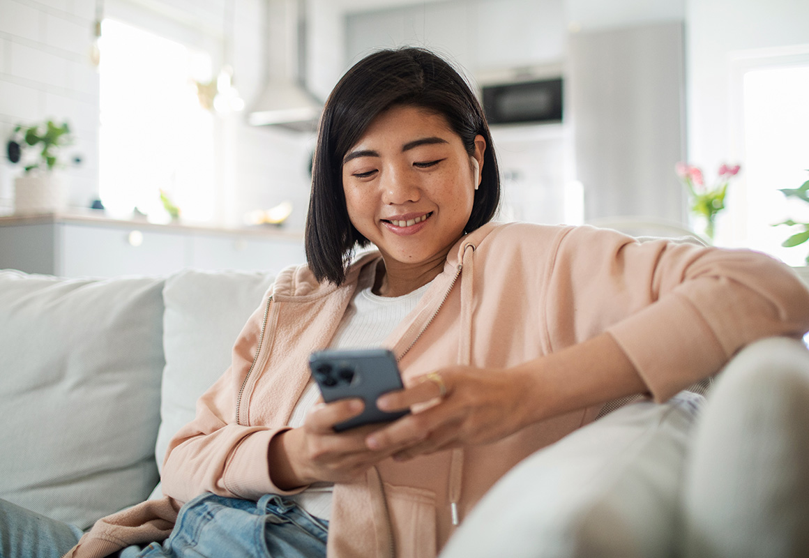 woman on cell phone on couch