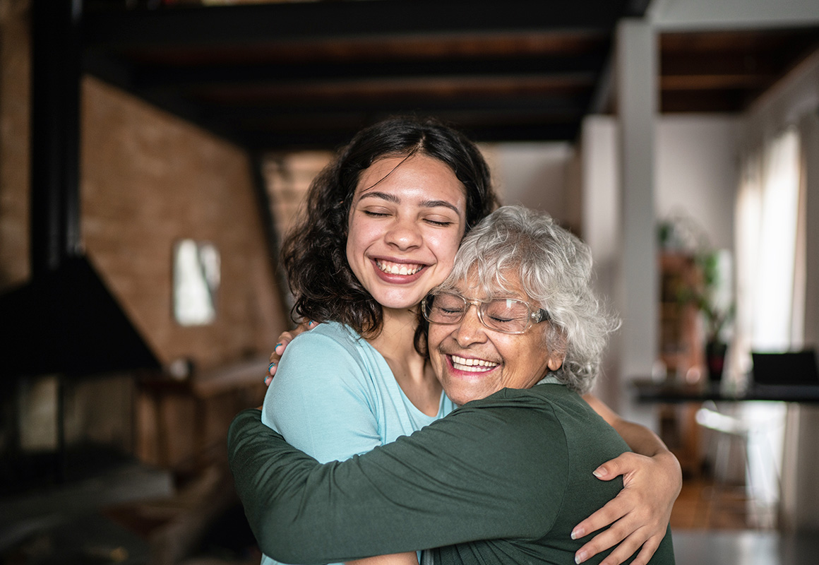 young and older women hugging