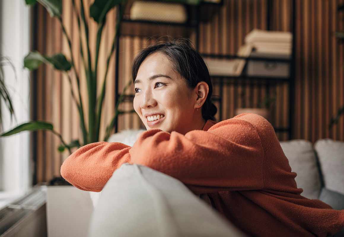 woman smiling on couch