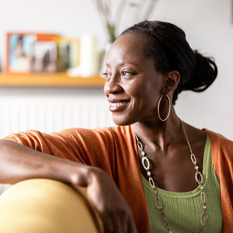 woman smiling on couch