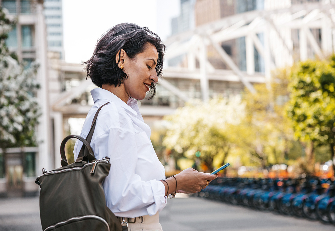 woman on phone in city setting