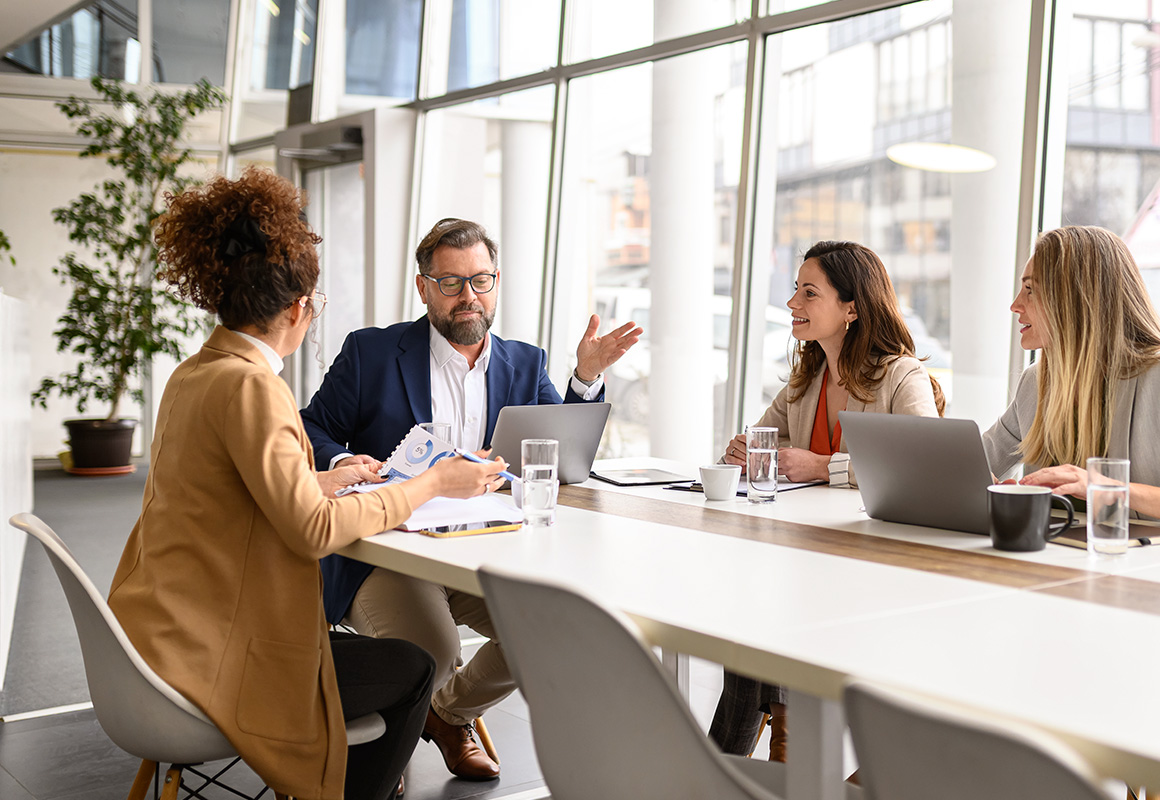 people at table in office