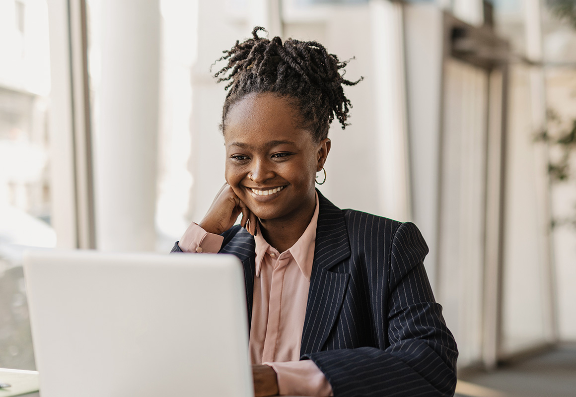 Woman in office with laptop