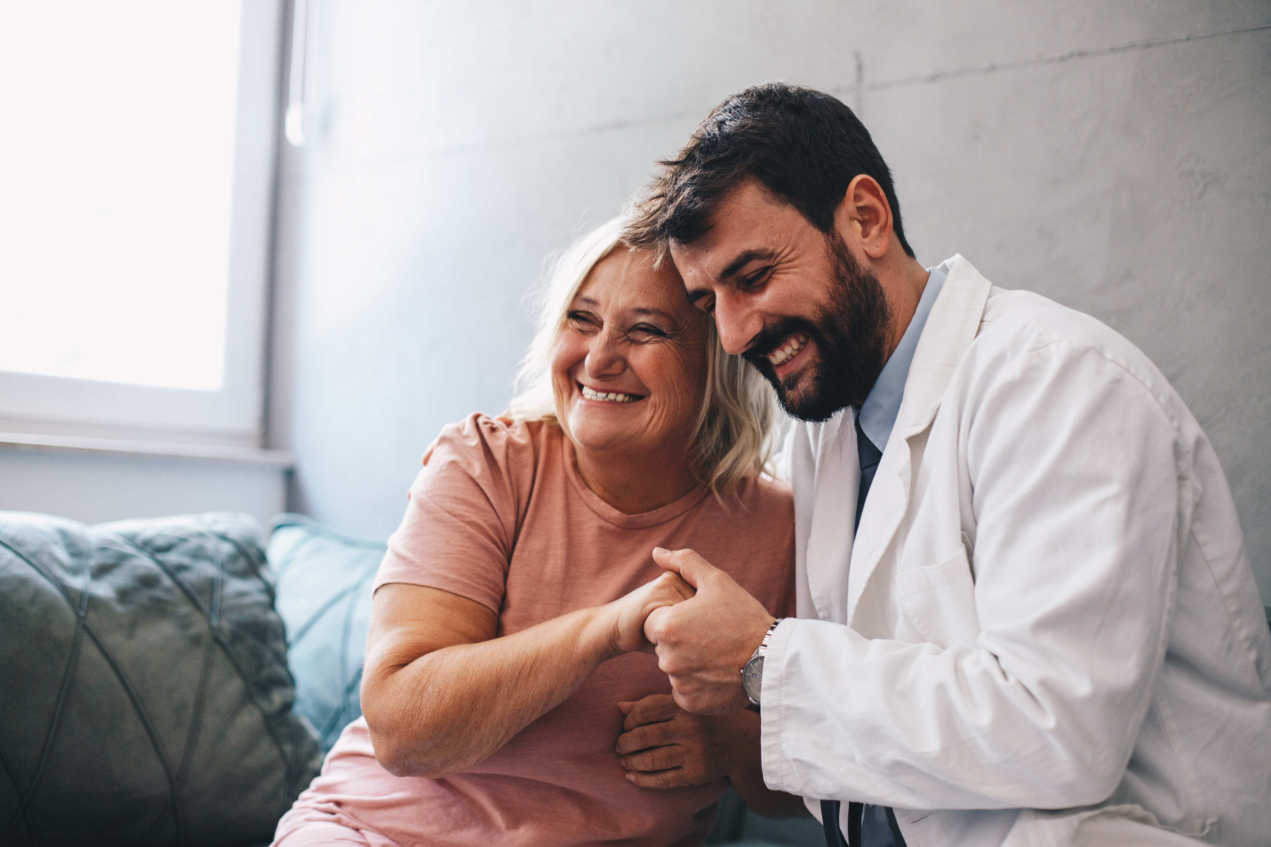 doctor smiling with female patient