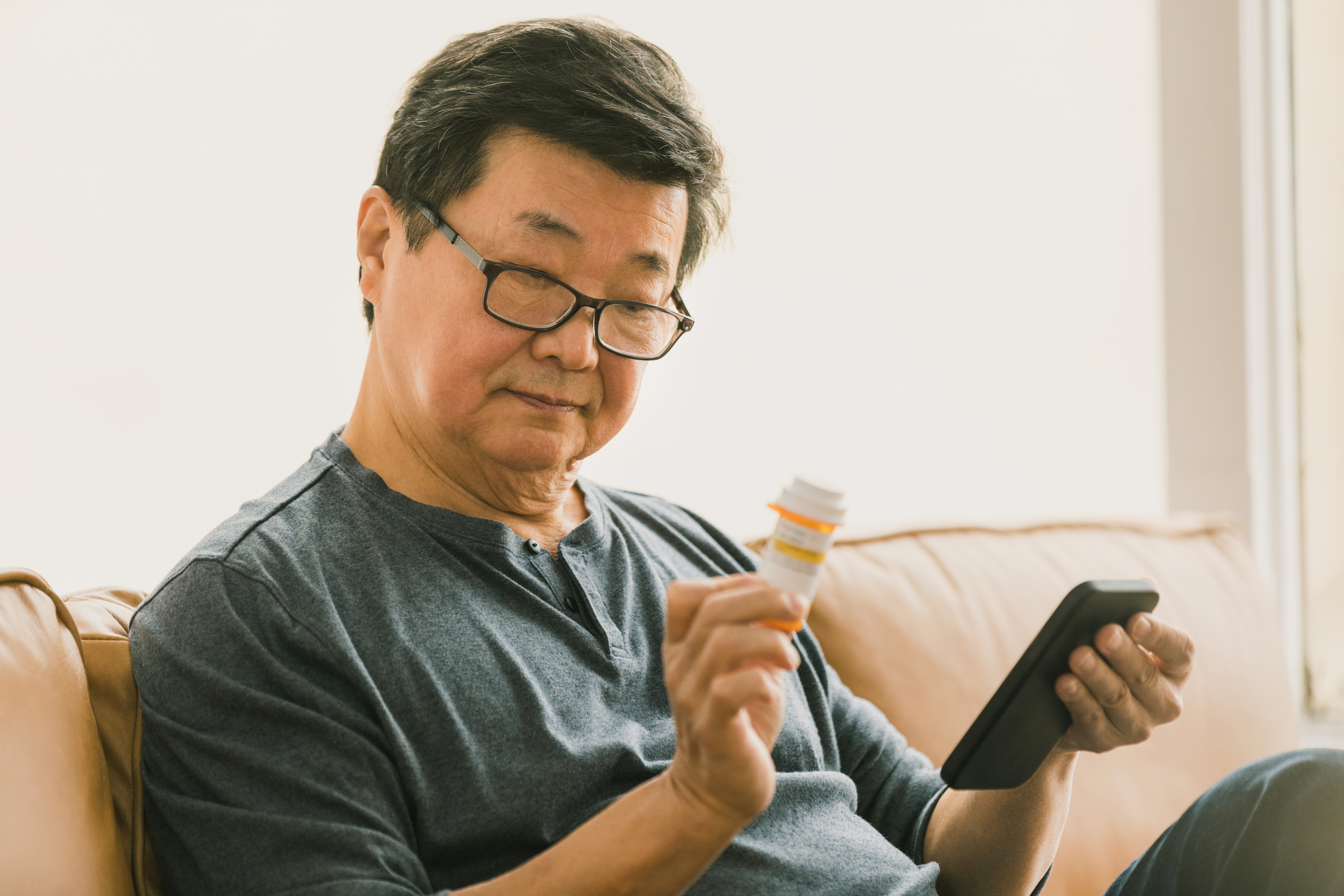 man on phone with pill