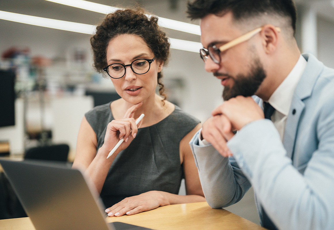 Consultants on computer in office 