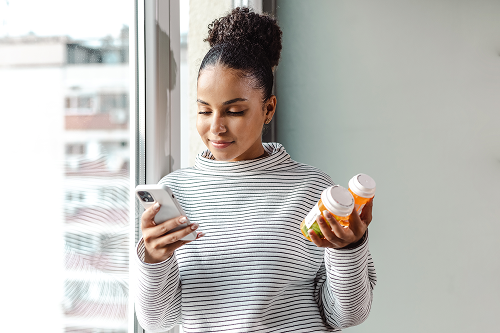 woman with pill bottle