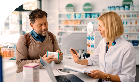 pharmacist with patient picking up