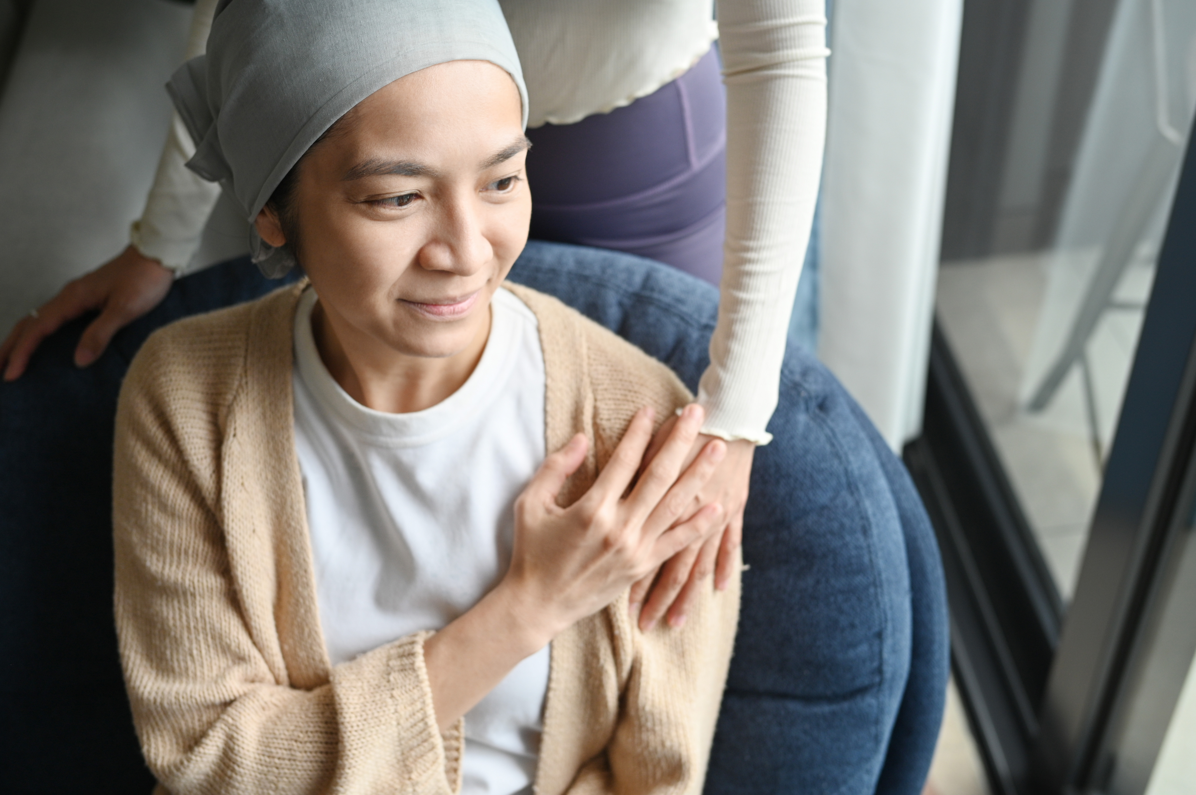 female cancer patient with caregiver