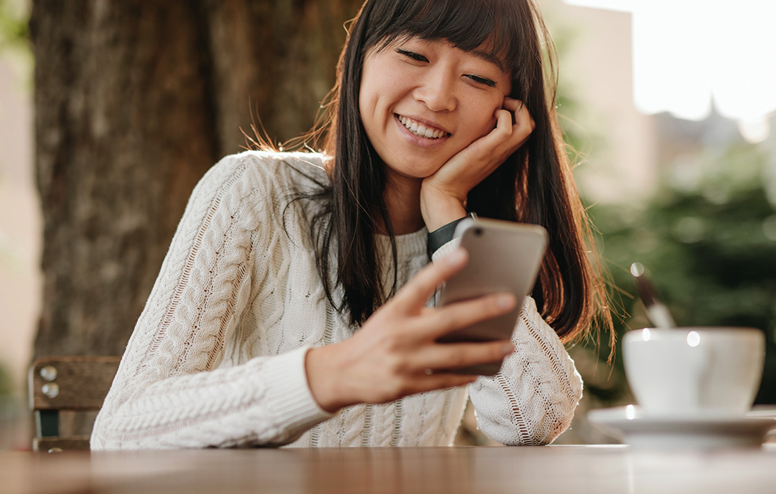 woman smiling on phone