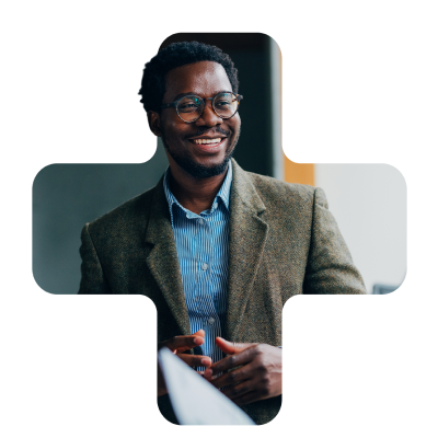 man in suit smiling with glasses