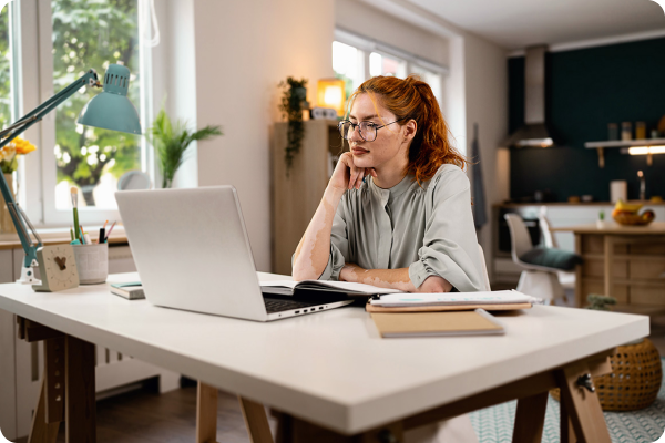 woman sitting at a desk on her laptop
