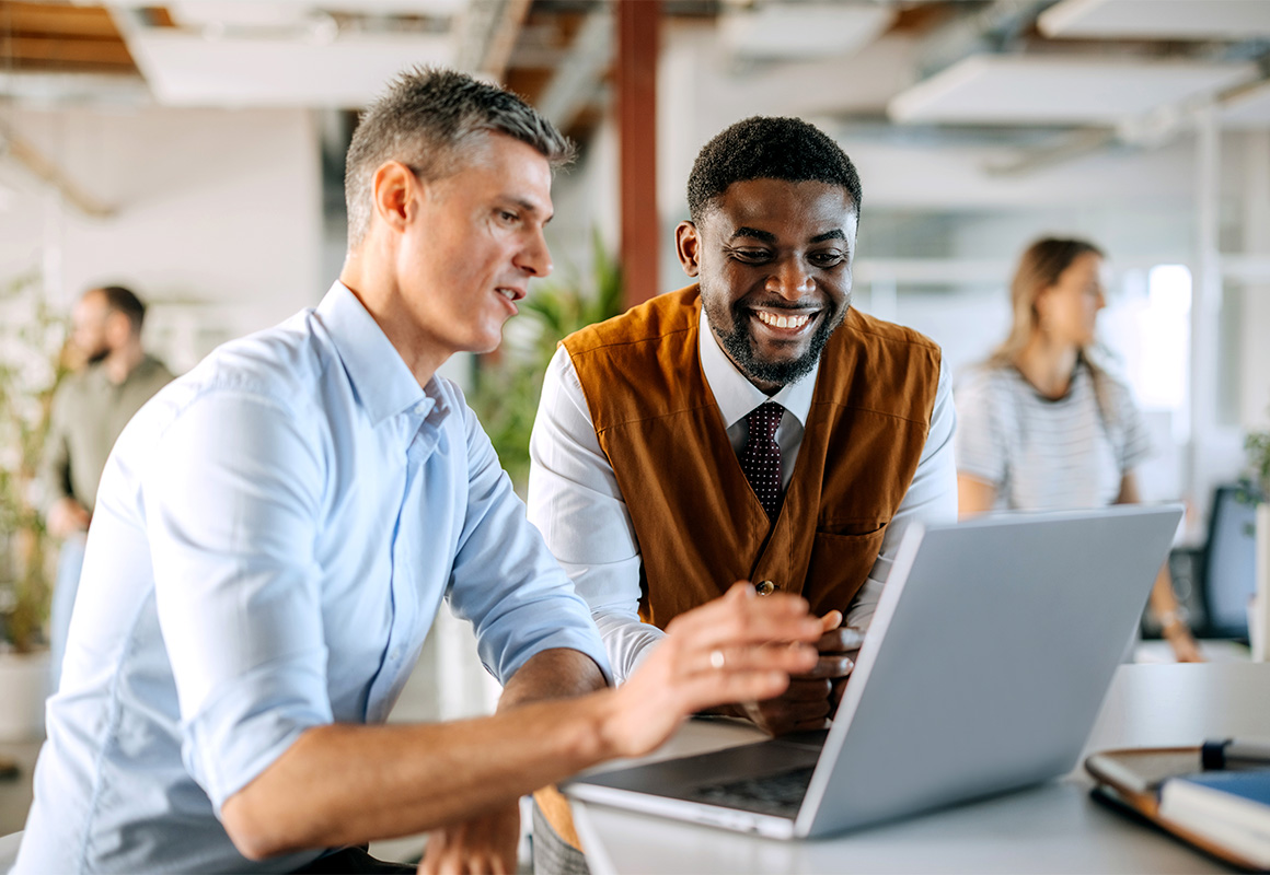 two men at laptop
