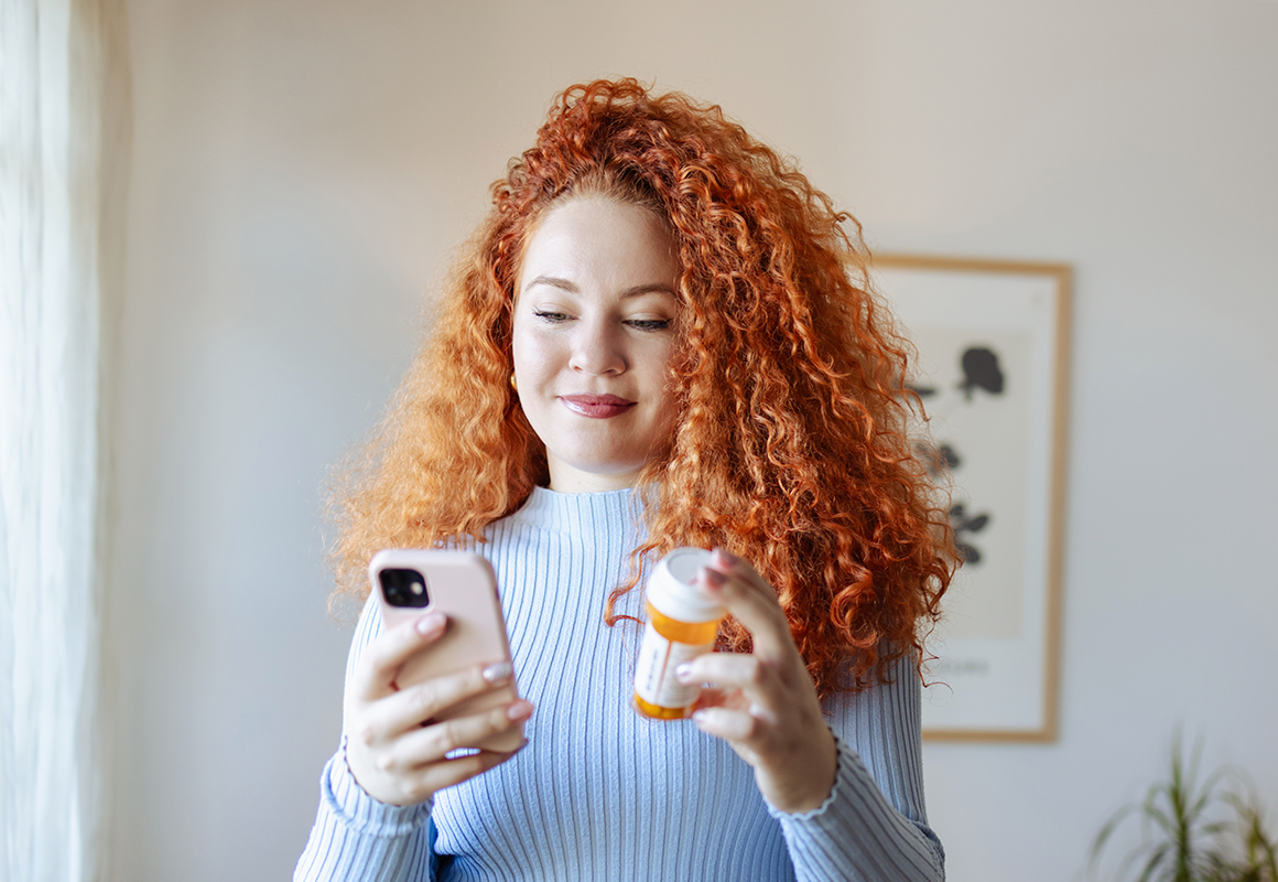 woman holding medicine