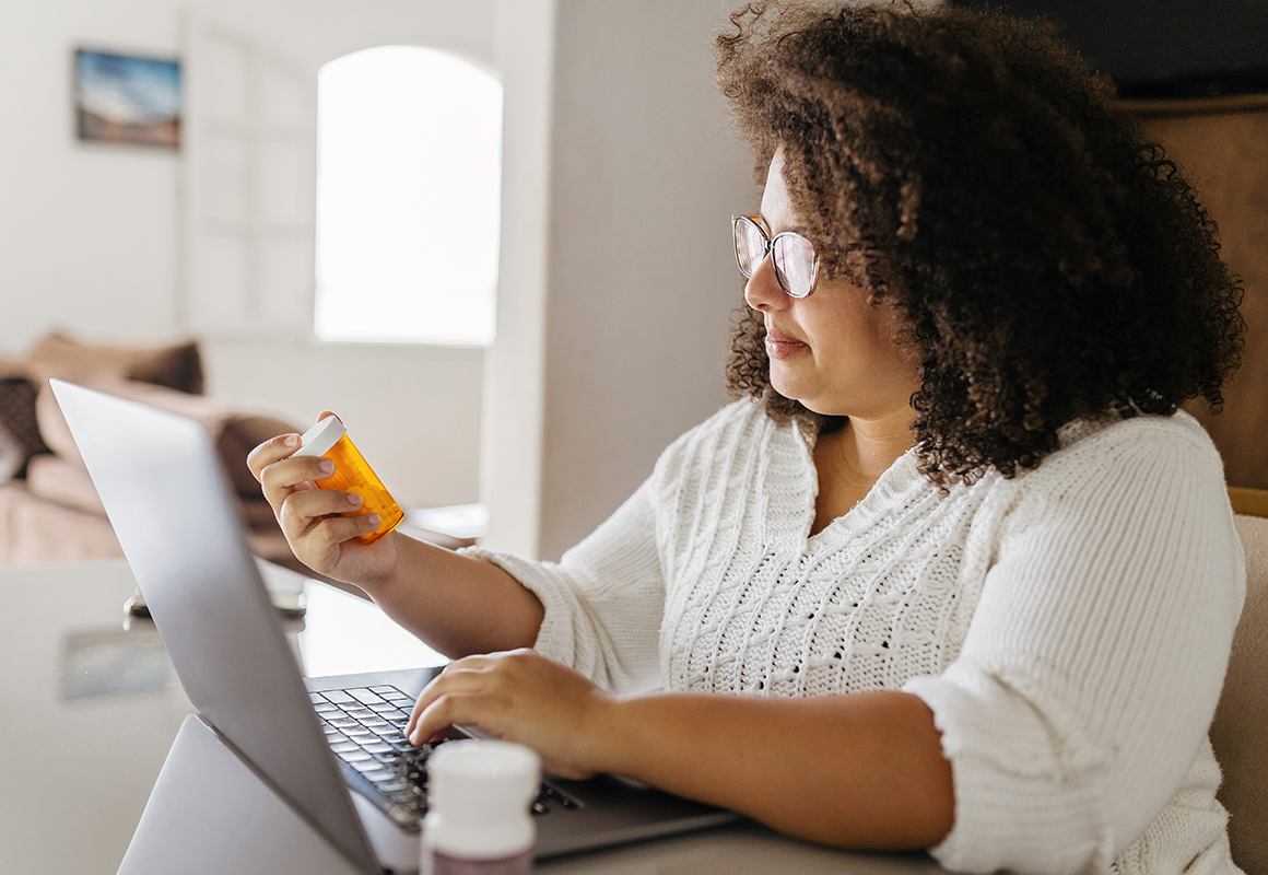 woman with pill bottle