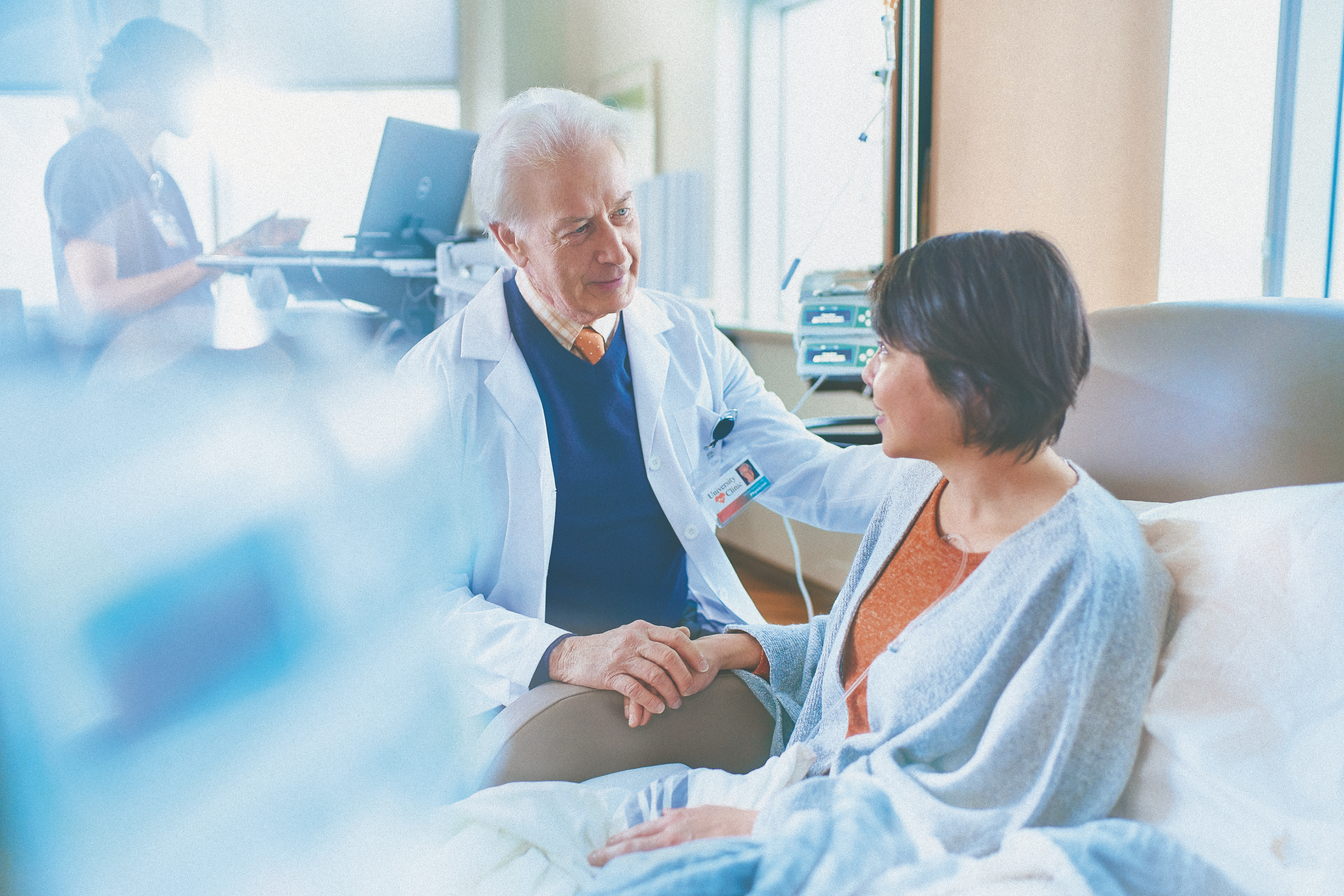 patient getting an infusion with her doctor