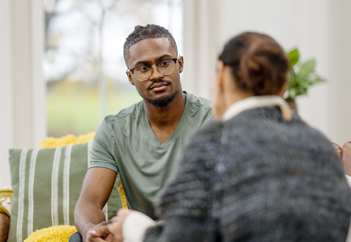 man speaking with a woman