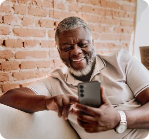 man on his cell phone smiling